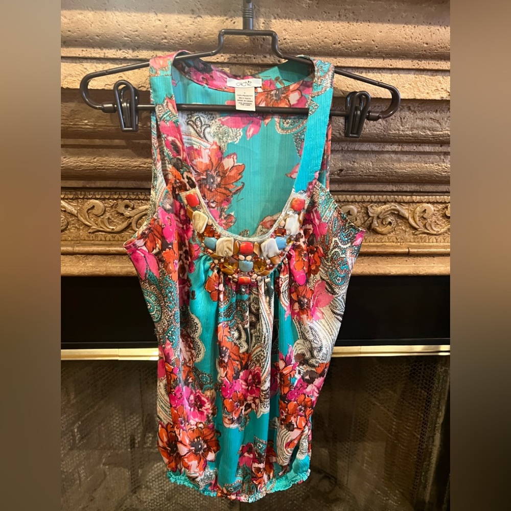 Cache gently used sleeveless top with stone embellishments. Size S